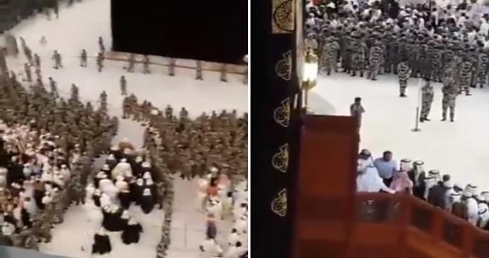 شاهد مئات الجنود السعوديين يطوقون ”الكعبة” وشخصية ”نادرة الظهور” تصعد عليها.. وصيحات المعتمرين تتعالى (فيديو)